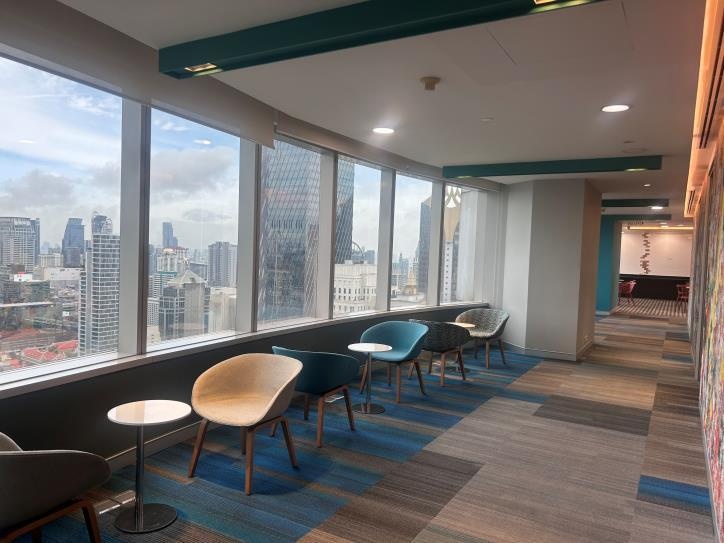 Light-filled office lounge overlooking the city
